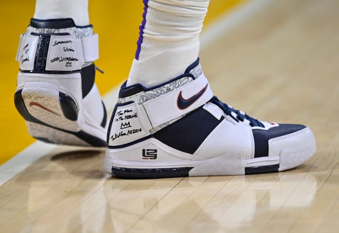 View of LeBron James' white and navy Nike shoes.